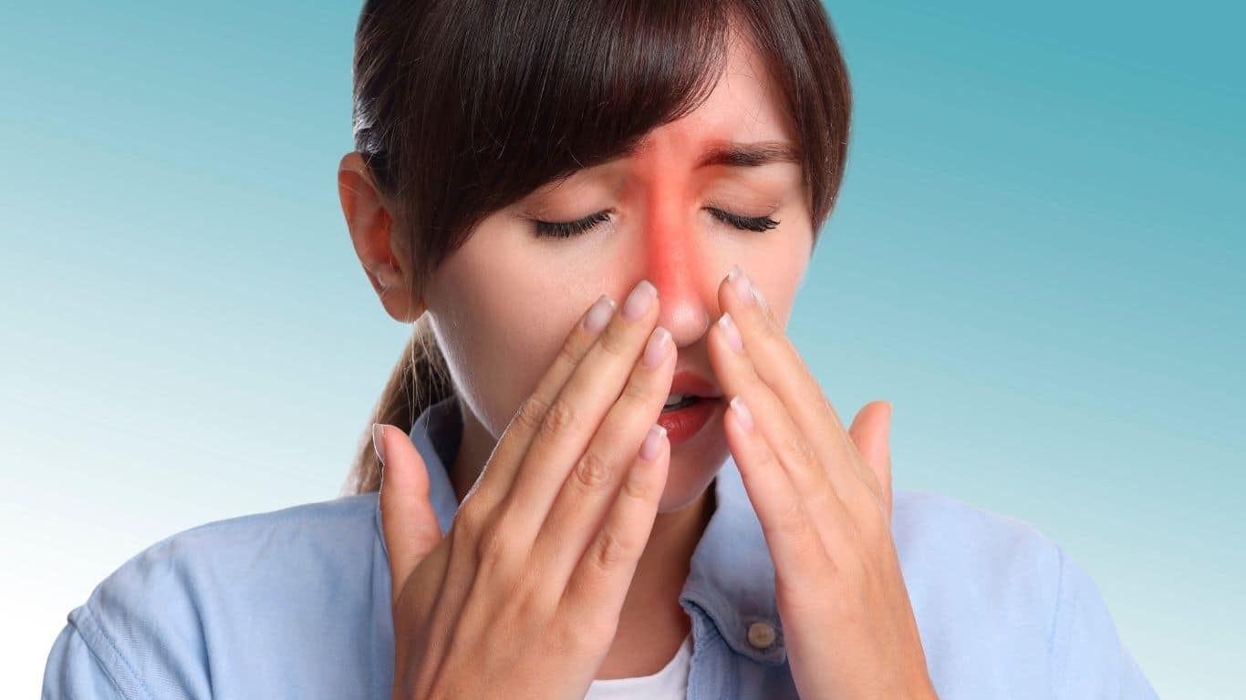 Woman suffering from sinusitis.
